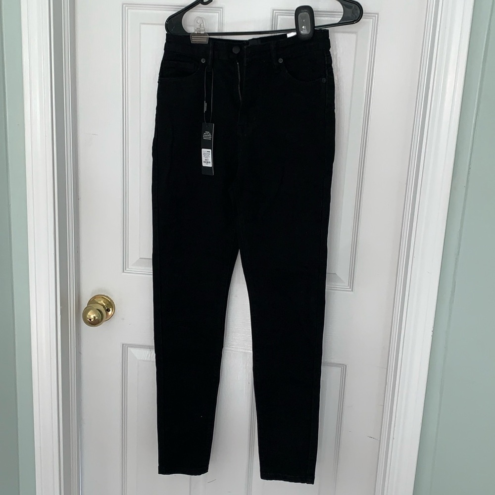 *Never worn* Black jeans. Size 7, NOT juniors.